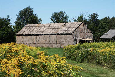 Seneca Indian elm bark longhouse at Ganondagan State Historic Site © STILLMAN ROGERS PHOTOGRAPHY