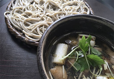 Guests learn to make buckwheat soba noodles at Tsukiji Soba Academy